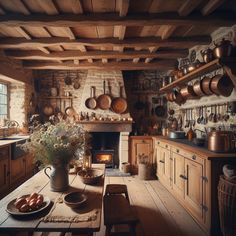 an old fashioned kitchen with wood floors and wooden cabinets, pots on the stove, and pans hanging from the ceiling