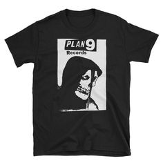 Plan 9 records Shirt T-Shirt• 100% ringspun cotton• 4.5 oz (153 g/m2)• Pre-shrunk• Shoulder-to-shoulder taping• Quarter-turned to avoid crease down the center Rocker Style Screen Print T-shirt For Streetwear, Rocker Style Graphic T-shirt For Streetwear, Black Band Logo T-shirt For Alternative Fashion, Black Deadstock T-shirt For Halloween, Band Logo T-shirt For Alternative Fashion, Black Rocker T-shirt With Graphic Design, Black Rocker Graphic T-shirt, Emo Screen Print T-shirt For Fans, Emo Style T-shirt With Screen Print For Fans