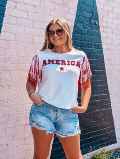 Be the star of every Fourth of July celebration with this super cute Sequin AMERICA Fringe Knit Top! This top features fringe, playful sequin, and the iconic star of the USA so that you can sparkle in style. Its short sleeve design is perfect for the blazing heat of the summer and will make any look shine. Are you ready to make a statement? Unisex sizing and fit SPECIAL CARE - WASHING INSTRUCTIONS: Hand washing and air drying are always best for these items. Wash on delicate, cold, and inside ou Fourth Of July Celebration, July Outfits, Fringe Shirt, Country Girls Outfits, Short Sleeve Design, 4th Of July Outfits, Sleeve Designs, Country Girls, Washing Instructions