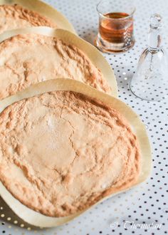 bread is sitting on a table next to some wine glasses