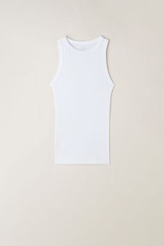 Crewneck racer back tank top in ribbed Superior cotton. Snug fit.
The model is 5’ 9” (175 cm) tall and is wearing a size S. White Ribbed Sleeveless Tank Top, White Sleeveless Ribbed Tank Top, Stretch Ribbed Racerback Camisole, White Stretch Ribbed Tank Top, White Ribbed Stretch Tank Top, Basic Ribbed Racerback Top, White Ribbed Camisole Top, White Ribbed Tank Top, Jennifer Lopez News