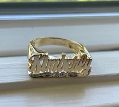 Medium Size Personalized Name Ring In Real 10K & 14K Gold *FLAT FACE * MADE IN USA (HAND MADE ITEM) Make the names of your family, friends and love ones into rings for their gift. It's great as an everyday necklace and makes an awesome gift! This Item is 100% customization especially for you. Item Description *Material: Real Gold *Type: *FLAT FACE* ( Like photo) with Heart Tail with Bit Work *Ring size: ring sizes between 1-11 (including half sizes) *Size of Ring : 20mm*8mm *Script Design *O Custom Name Engraved 14k Gold Ring, 14k Gold Engraved Ring For Promise With Names, Yellow Gold Engraved Ring With Names For Promise, 14k Gold Promise Ring With Names, 14k Gold Rings With Names, 14k Gold Engraved Names Ring For Anniversary, 14k Gold Nameplate Promise Ring, Gold Engraved Ring With Custom Name For Promise, 14k Gold Rings With Names For Anniversary