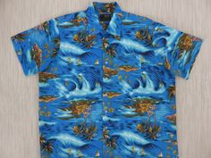 "Oahu Lew's on a surfin' safari!  Let's go surfin' now everybody's learnin' how... Wax up your board and take to the waves with all the surfer girls and surfer guys. Be in with the beach crowd wearing this vintage Hawaiian shirt from VAN CORT! Oahu Lew's Shirt Shack is your on-line source for authentic, classic, original vintage California and Hawaiian shirts and ties. Manufacturer: VAN CORT, distributed by F.W. Woolworth Co., N.Y., N.Y. 10007 Made in Korea Features:  Hip surfer print fabric, st Hawaiian Short Sleeve Camp Shirt For Surfing, Hawaiian Camp Shirt For Surfing, 70s Van, Surfer Guys, Surfer Shirt, Surfer Print, Beach Boy, Surf Shirt, Vintage Hawaiian Shirts