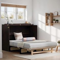 a bed sitting in the middle of a room next to a wooden dresser and window