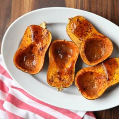 four pieces of stuffed sweet potatoes on a white plate