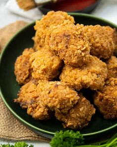 some fried food is on a green plate