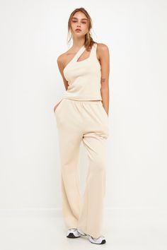 Step up your lounge game with our chic wide knit pants. These pants are sure to become your new favorite, whether you're relaxing at home or running errands. The wide leg and knit fabric give them a stylish look, while the beige cream hue makes them easy to pair with any top. Plus, they're so comfortable you'll never want to take them off! Wide pants Knit Elastic at waist Shell: 55% Cotton 43% Polyester 2% Spandex JJ941P XS Total length: 42.75", Waist: 26", Inseam: 30.5" Beige Stretch Sweatpants For Loungewear, Beige Ribbed Pants For Loungewear, Ribbed Beige Pants For Loungewear, Chic Ribbed Beige Pants, Chic Beige Ribbed Pants, Chic Neutral Wide Leg Pants For Loungewear, Chic Neutral Wide Leg Loungewear Pants, Cream Ribbed Loungewear Pants, Neutral Wide Leg Pants For Loungewear