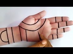 a person's hand with lines drawn on it