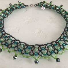 Czech Glass Bead 20" Long "Carmen" Style Necklace Beautiful Iridescent Greens In A Beaded Crocheted Lace Style Easy To Open/Close Magnetic Clasp Because Of The Handmade Nature; No Two Necklaces Are Exactly The Same A Gorgeous Necklace Made In Guatemala Using Artisan Crafted Czech Glass Beads. Czech Glass Beads Are Know World Wide For Their Quality. Principles Of Fair Trade Are Upheld. Please Visit Our Posh Closet For Complete Enchanted Line: Necklaces,Bracelets & Earrings Czech Jewelry, Enchanted Jewelry, Two Necklaces, Iridescent Green, Crocheted Lace, Czech Crystal, Beaded Jewelry Patterns, Czech Beads, Style Necklace