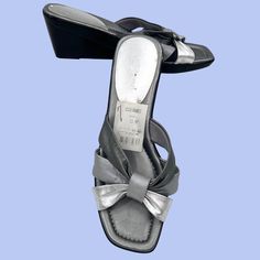 New W/ Tag Pair Of Fabulous Liz Claiborne Faye Tri-Color (Pewter, Dark Silver, Light Silver) Metallic Silver Leather Wedge Sandals/Heels! Size 7m, 2.5" Wedge Heel. Some Nicks/Scratches (Please Zoom In) And The Silver Is Coming Off On The Tag (See Last Pic.) But Otherwise In Great Condition. Features: Wedge, Heels Size: Womens 7 Condition: New With Tags Silver Wedge Sandals, Memory Foam Sandals, Silver Wedges, Brown Wedges, Cork Wedges Sandals, High Heel Wedges, Strappy Wedges, Strappy Sandals Heels, Leather Wedge Sandals