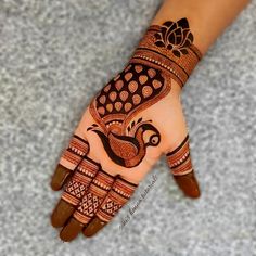 henna tattoo on the palm of someone's hand