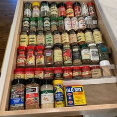 an open drawer with spices and seasonings in it