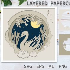 the paper cut swan is sitting in front of some flowers and leaves, with an image of