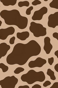 an animal print pattern that is brown and white with black spots on the bottom half of it