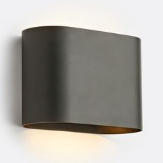 an image of a modern wall light that is on the side of a building or house