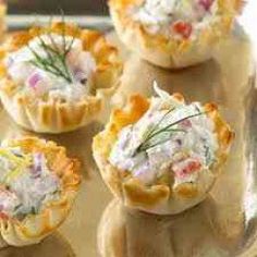 several small appetizers are sitting on a tray