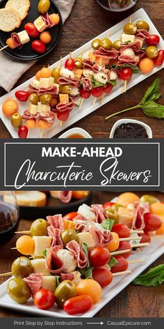 an assortment of appetizers on skewers with olives, tomatoes and ham