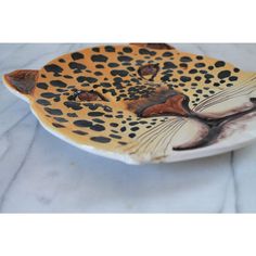 a ceramic plate with a leopard design on it