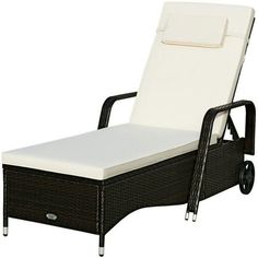 an outdoor chaise lounge chair with white cushions and black frame, viewed from the side