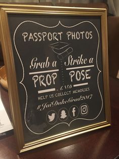 a black and gold framed chalkboard sign with the words, passport photos grab a strikea prop pose help us collect memories