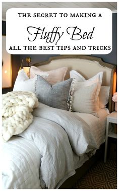 a bed with pillows and blankets on top of it in front of a wall that says, the secret to making a fluffy bed all the best tips and tricks