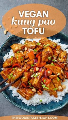 a blue plate topped with chicken and vegetables on top of rice next to chopsticks