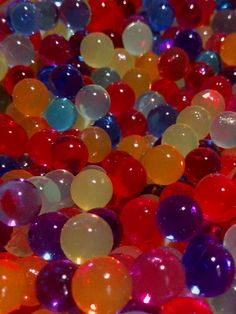 many different colored balls are scattered together