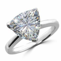 a white gold ring with a pear shaped diamond