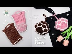 two crocheted purses are next to each other and one has a flower in it