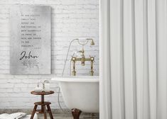 a white bathtub sitting next to a wooden stool in front of a brick wall