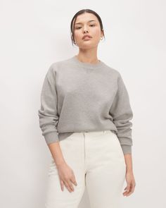 Loungewear, elevated. The Cotton-Merino Sweatshirt is a luxe sweater version of your favorite sweatshirt. Made with an RWS-certified wool and organic cotton blend, it features detailed stitching at cuffs and body hem, with an easy fit throughout (aka comfy af). Pair this sweater with a premium pair of denim for a relaxed, casual look. The Responsible Wool Standard (RWS) sets requirements for third-party certification to ensure that wool comes from farms that manage their land with a progres Everlane Outfit, Gray Sweatshirt Outfit, Tomboy Femme, Merino Sweater, Soil Health, Sweatshirt Outfit, The Sheep, Knit Sweatshirt, Animal Welfare