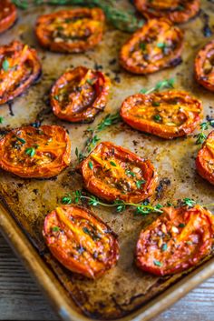 sliced tomatoes on a baking sheet ready to be baked in the oven or used as an appetizer