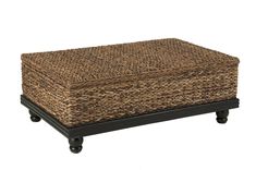 a large wicker box with black legs