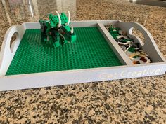 a lego tray that has some elephants in it