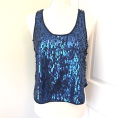 Forever 21 Navy Blue Sequins Crop Top. Length Is Approximately 19.5". Shell 1: 64% Polyester/36% Rayon. Shell 2: 100% Polyester. Trendy Blue Tank Top For Party, Trendy Blue Party Tank Top, Trendy Blue Tank Top For Night Out, Blue Stretch Tank Top For Party, Blue Stretch Tank Top For Night Out, Stretch Blue Tank Top For Night Out, Chic Blue Tank Top For Night Out, Blue Tank Top For Summer Parties, Sequin Crop Top