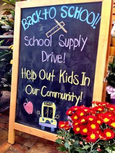 a sign that says back to school drive, help out kids in our community with flowers