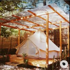 a tent set up in the middle of a yard