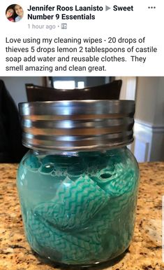 a jar filled with blue liquid sitting on top of a counter