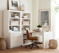 a white desk and chair in front of a bookshelf with baskets on it