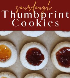 there are some cookies with jam on them and the title says sourdough thumbprint cookies