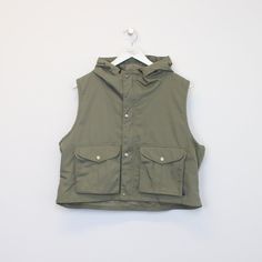 SKU - DM5331  Vintage Pract.s vest in green. Best fits M DETAILS:  ▫️ Front pockets ▫️ Zip up   👕 Fits like a ~ M ▫️ Label states ~ L ▫️ Pit to Pit ~ 23" ▫️ Length ~ 19.5" ▫️ Pit to Cuff ~ N/A   👇 If any defect is found and it is not included in the provided photos, it will be listed below. ▫️    🧺 All items are professionally washed and ironed before photos are taken and then sold.    ✅ If the item is listed, it is available    ❌ Disclaimer: Like all vintage items they may have slight imperf Military Tops With Pockets For Outdoor Activities, Casual Green Sleeveless Vest, Utility Sleeveless Tops With Pockets, Sleeveless Utility Top With Pockets, Military Style Green Tops For Streetwear, Khaki Sleeveless Vest For Streetwear, Sleeveless Khaki Vest For Streetwear, Casual Khaki Sleeveless Vest, Casual Sleeveless Khaki Vest