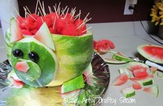 a watermelon sculpture made to look like a hedgehog