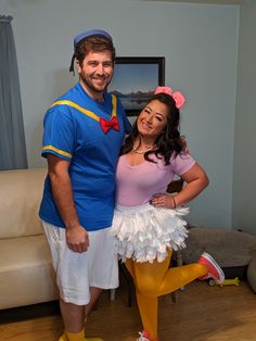 a man and woman dressed up in costumes