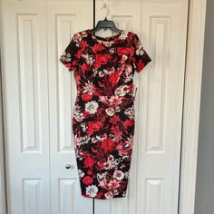 Floral Body-Con Midi Dress. New With Tags. This Print Is Absolutely Stunning And The Cut Very Figure Flattering. Material Is Like A Scuba Fabric. Has Back Of Approximately 8”. Other Approximate Measurements: Length-42.5” Chest - 17” Waist - 15” Elegant Red Floral Midi Dress, Elegant Red Fitted Floral Dress, Red Floral Print Sheath Dress, Scuba Fabric, Dresses Floral, Floral Midi Dress, Black And Red, Midi Dress, Size Medium