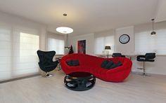 a living room with red couches and black chairs