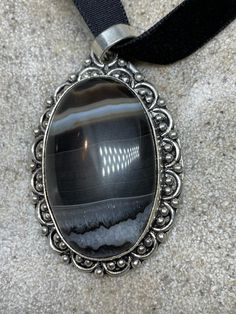 Vintage Silver Genuine Banded Black Onyx Agate Choker Black Velvet Ribbon Pendant Necklace https://www.etsy.com/listing/1030579635/vintage-silver-genuine-banded-black-onyx?utm_source=crowdfire&utm_medium=api&utm_campaign=api Vintage Black Jewelry With Natural Stones, Silver Onyx Oval Pendant Jewelry, Silver Onyx Jewelry With Large Stone, Silver Onyx Oval Pendant, Vintage Silver Necklace With Large Stone, Antique Silver Agate Jewelry, Antique Agate Silver Jewelry, Collectible Black Jewelry With Large Pendant, Black Bohemian Collectible Jewelry