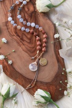 Luminous Trust Mala is hand-knotted with 6mm Chalcedony, Rosewood, Labradorite, & 4mm Faceted Labradorite on silk cord. 14k Goldfilled Hand-wrapped Moonstone drop, Gold Plated 11:11 Crescent Moon Charm, Labradorite drop and 14k Goldfilled and Gold Vermeil accents. 108 Meditation beads. _____________________________ Blue ChalcedonyBlue Chalcedony is a soft blue translucent stone with creamy beige inclusions and swirls. A cooling and mystical stone Blue Chalcedony is known as the “Speaker’s Stone” activating the Throat Chakra promoting ease of communication of ideas, beliefs, and emotions with clarity, openness, and personal truth. Blue Chalcedony is a nurturing stone that absorbs negative energy, eases self doubt, and calms panic, anxiety, and overwhelming thoughts. Soothing and balancing B Overwhelming Thoughts, Personal Truth, Bracelet Size Chart, Meditation Beads, White Howlite, Silver Jewels, Silk Cord, Throat Chakra, Moon Charm