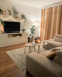 a living room filled with furniture and a flat screen tv