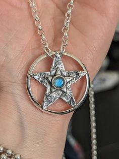 "How about this for a bit of bling? 🤩 A gorgeous detailed silver star set on a 3cm diameter chunky silver ring with \"LOVE\" on the reverse and a 6mm Blue Labradorite in its center. The chain is a 26\" 3mm belcher with some ring detailing and sliders ( my new favourite thing) to fiddle with. Lovely ring detailing at the neck with a small hanging hallmarked silver star. All .925 Sterling Silver." Chunky Silver Rings, Star Silver, Blue Labradorite, Lovely Ring, Silver Stars, Sterling Silber, Sliders, Labradorite, Silver Ring