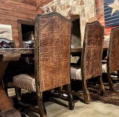 a dining room table and chairs with an american flag in the background